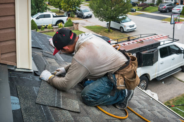 Professional Storm Damage Roof Repair technician working in Still River, MA